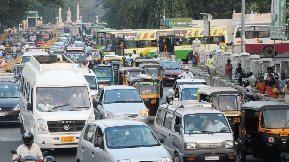 Heavy traffic chokes K.R. Circle, Sayyaji Rao Road