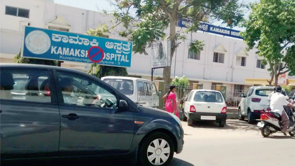 Curb illegal parking and provide bus shelters on  Kamakshi Hospital Road