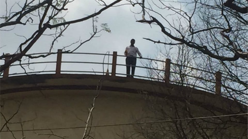 Police rescue man atop water tank