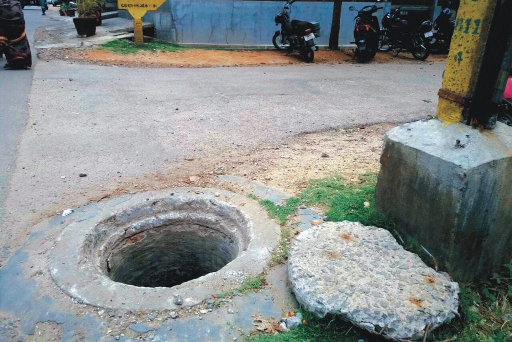 Beware! An open manhole on Buddha Marga at Siddarthanagar