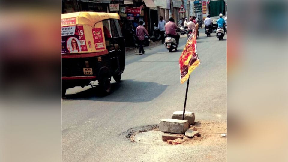 Replace broken manhole near Ashoka Road