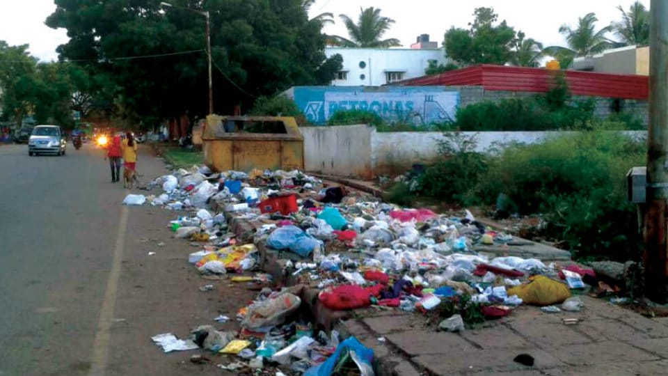Garbage bin placed on footpath of Adichunchanagiri Road