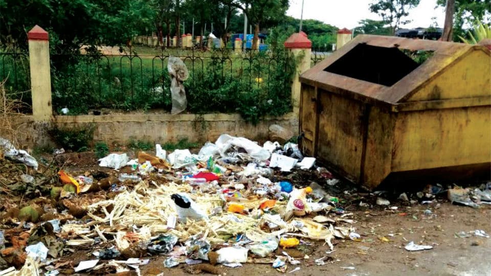 Clear this garbage dumped near JSS School in Siddarthanagar