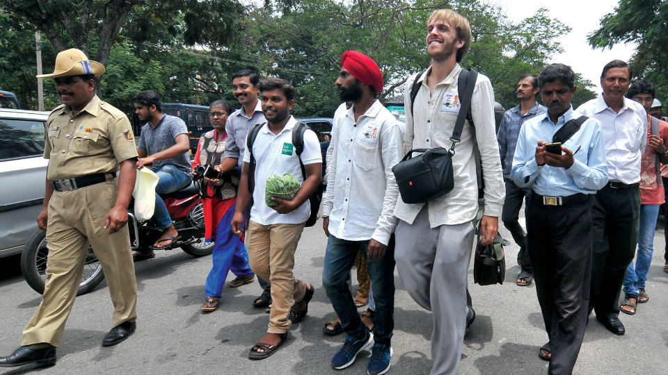 ‘Walk of Joy’ enters city: Britisher on a mission to raise funds for Indian farmers  