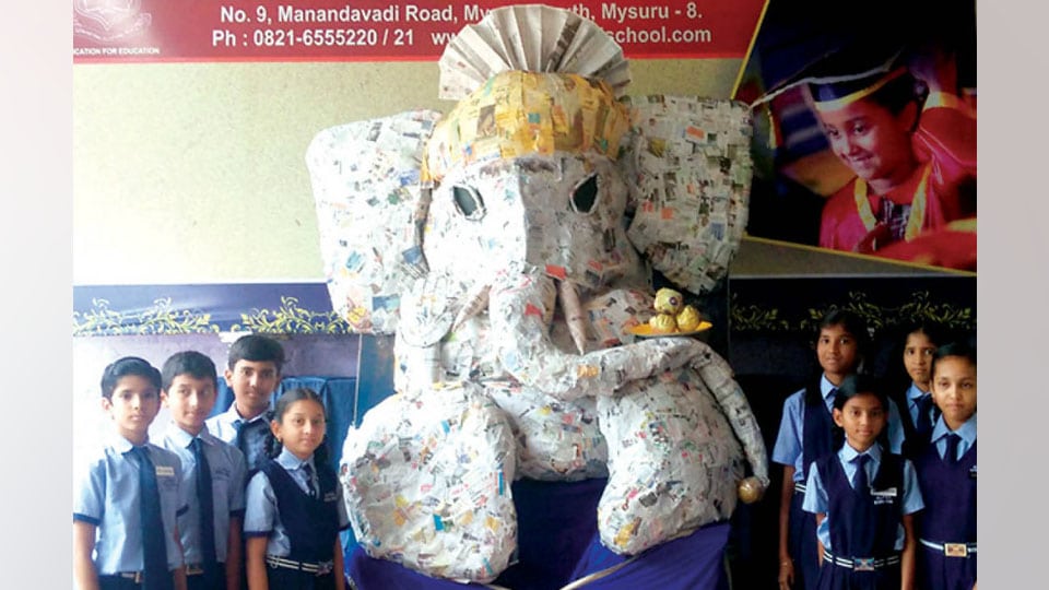 Students mould paper Ganesha