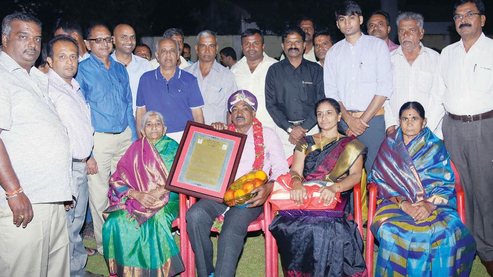 Swimming Coach Puttaswamy feted