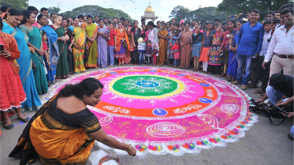 Colourful thematic rangolis attract passers-by