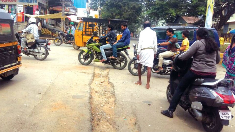 Damaged roads cause frequent mishaps at Maruthi Circle