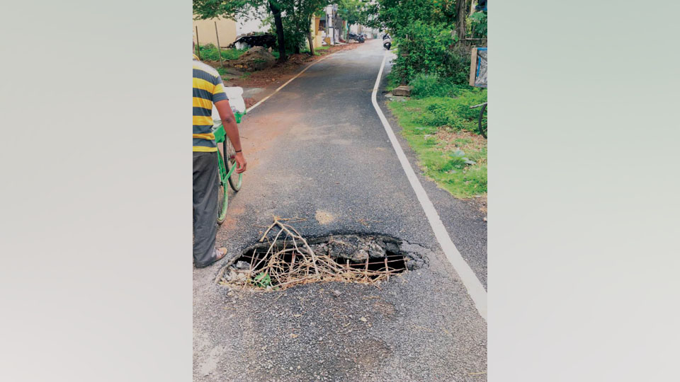 Caved-in road posing danger in Gayathripuram