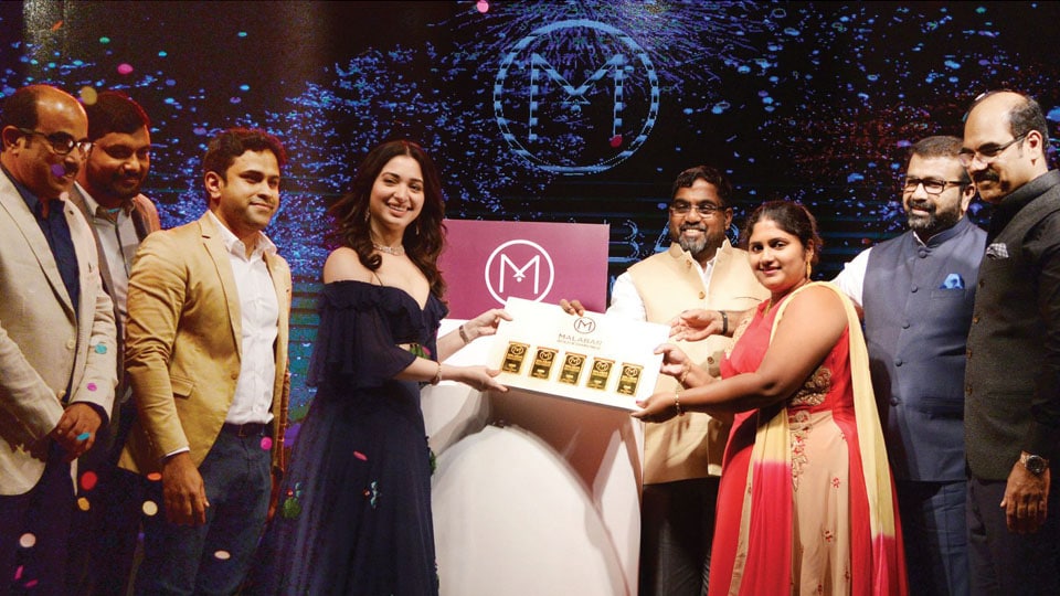 Actress Tamannaah presents 5-kg Bumper Prize to Malabar Gold lucky winner