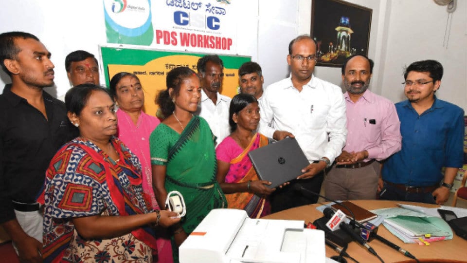 DC distributes free laptops for Fair Price Shop owners