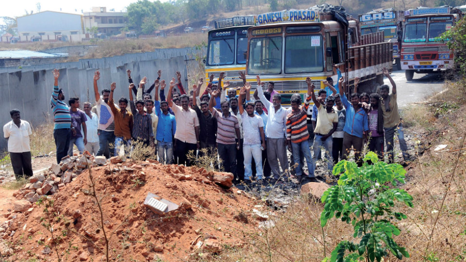 Truckers demand Railways to clear public road