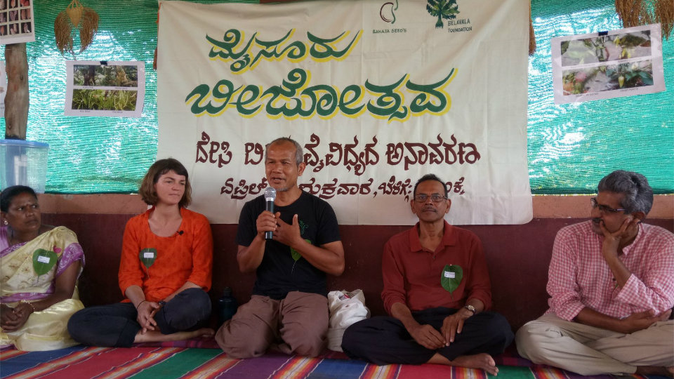Thailand farmer Jon Jandai interacts with organic farmers
