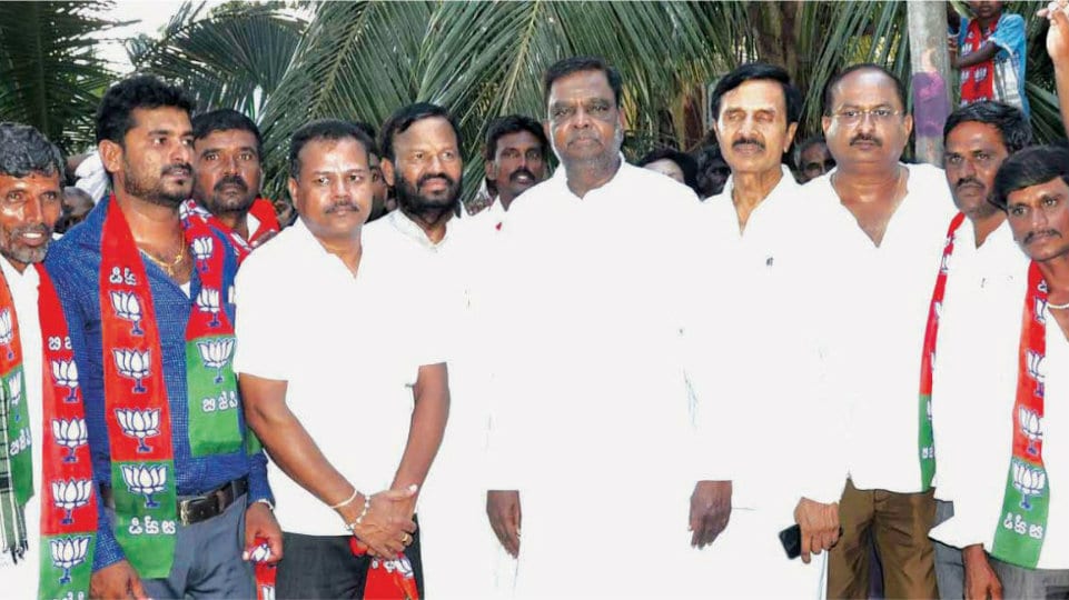 Former Minister Sreenivasa Prasad seeks votes for his son-in-law in Nanjangud
