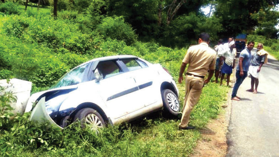 Four persons injured as car topples