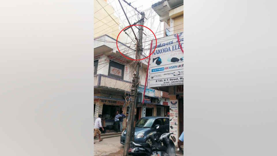 Wires dangerously connected to electric pole on K.T. Street