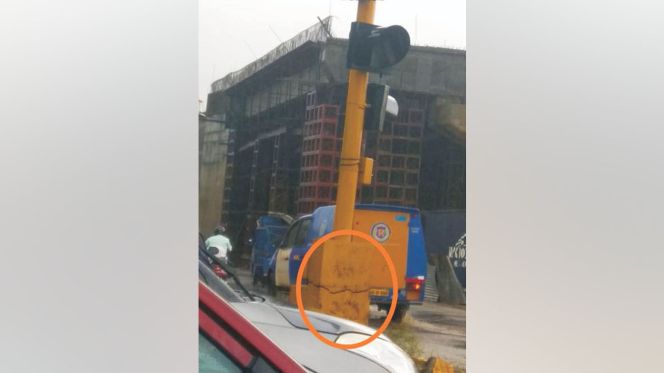 Traffic light pole posing danger on Hunsur Road junction