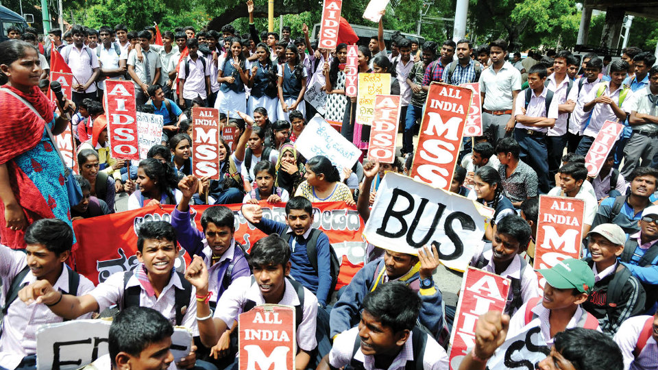 Hundreds of students stage dharna for free bus pass
