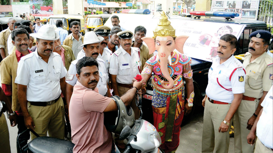 ‘Take care of your head’:Lord Ganesha tells helmetless riders
