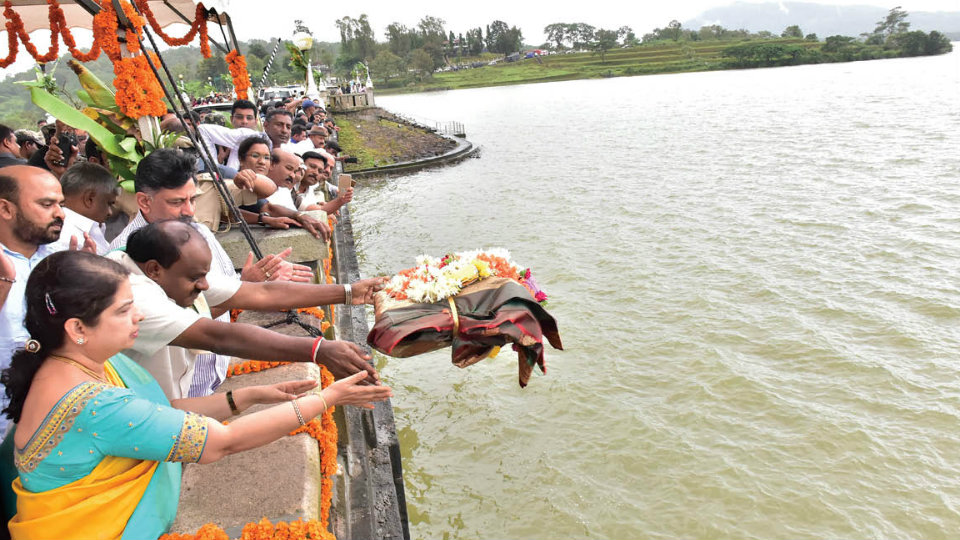 CM H.D. Kumaraswamy, wife offer baagina at Harangi Dam, perform puja at Talacauvery in Kodagu