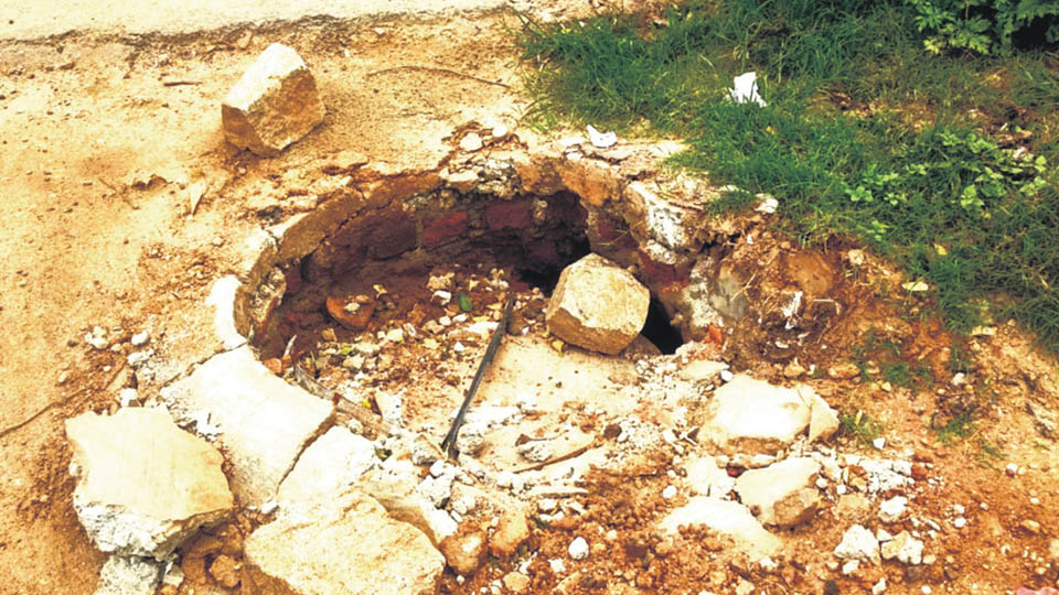 Replace the damaged manhole cover in Gayathripuram