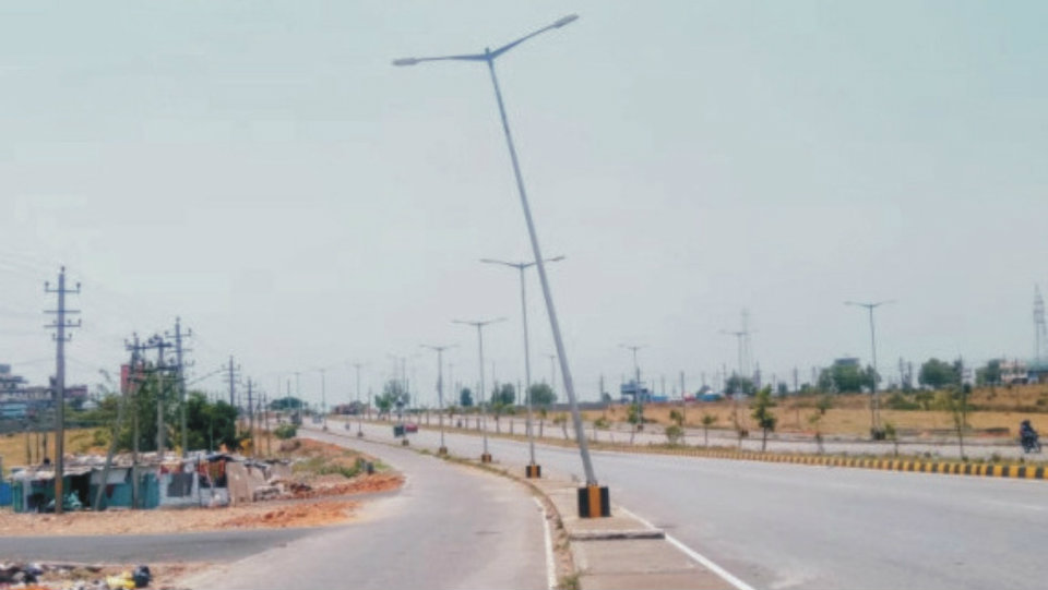 Lamp post leaning dangerously on Ring Road near Sathagalli