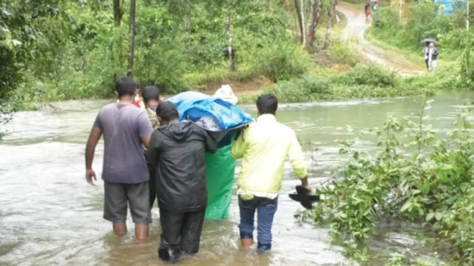 Overflowing rivers, streams : Villagers going through harrowing time even to perform last rites of dear ones