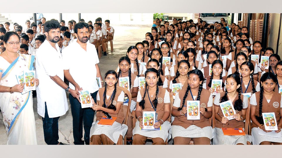 MP distributes Modi’s Exam Warriors Kannada books to students