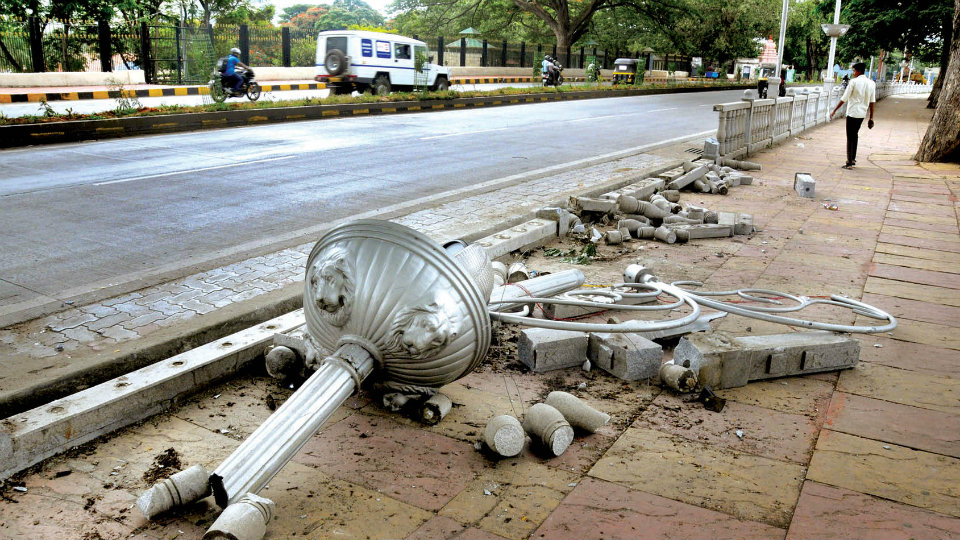 Ornamental lamp post on Dasara Exhibition Road damaged