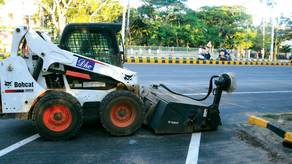 Sweeping machines clean city roads