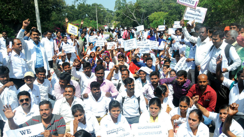 Hundreds of contract health staff take out protest rally