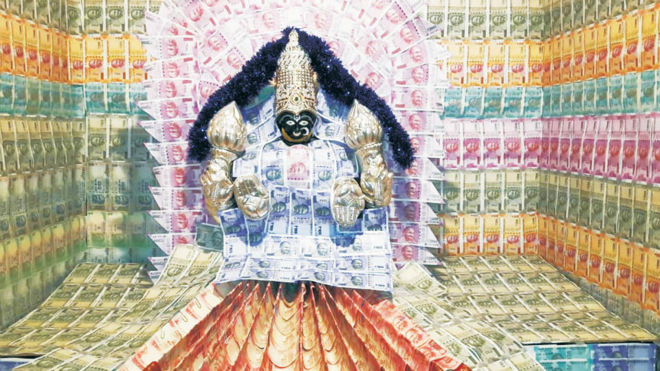 Nearly Rs. 8 lakh currency notes, coins adorn Goddess at Amrutheshwara Temple