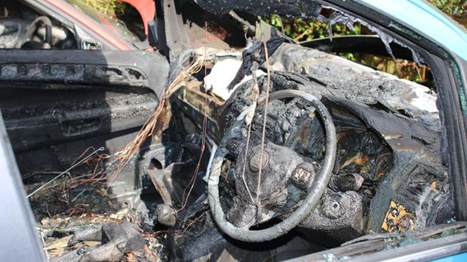 Car gutted in fire as power line falls on it
