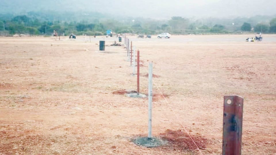 Fencing work continues on land near Lalitha Mahal Helipad