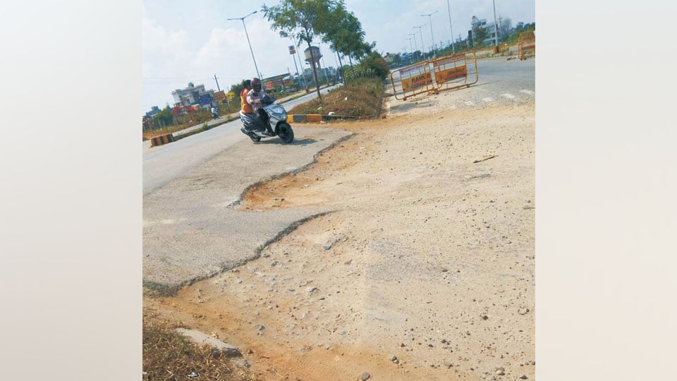 Plea to asphalt damaged road near J.P. Nagar