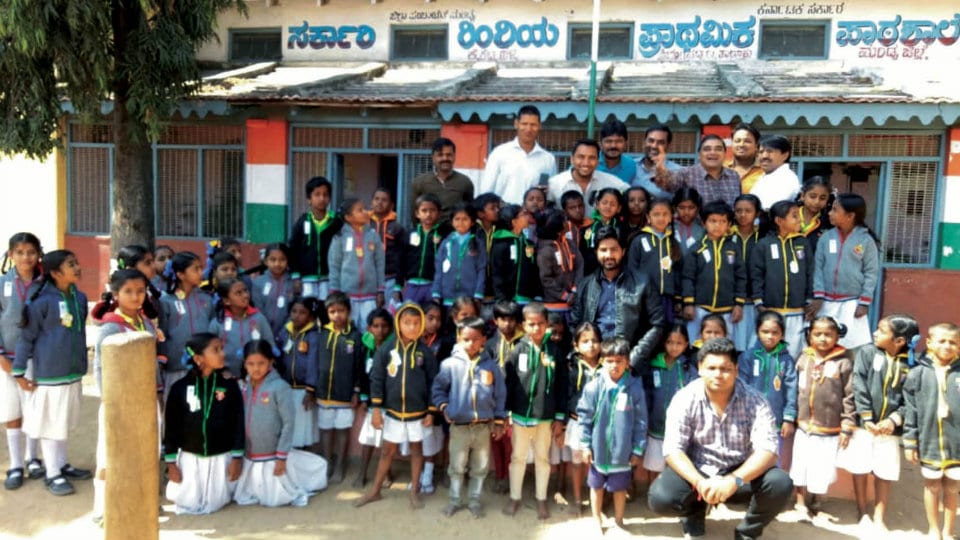 Sri Sumathinath Jain Navyuvak Mandal distributes sweaters to students