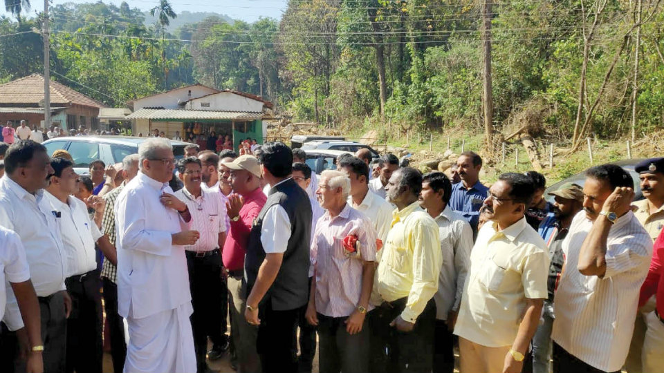 Dr. Veerendra Heggade distributes cheques to flood victims in Kodagu