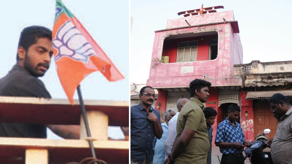 BJP workers engage in wordy duel with authorities over removal of party flags