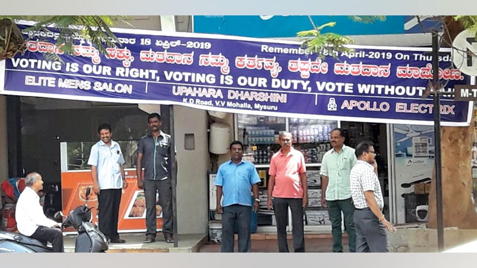 Three shops on Kalidasa Road display banner on voter awareness