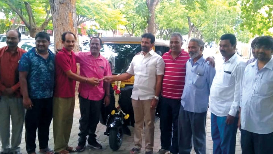 MLA hands over autorickshaw keys to beneficiary