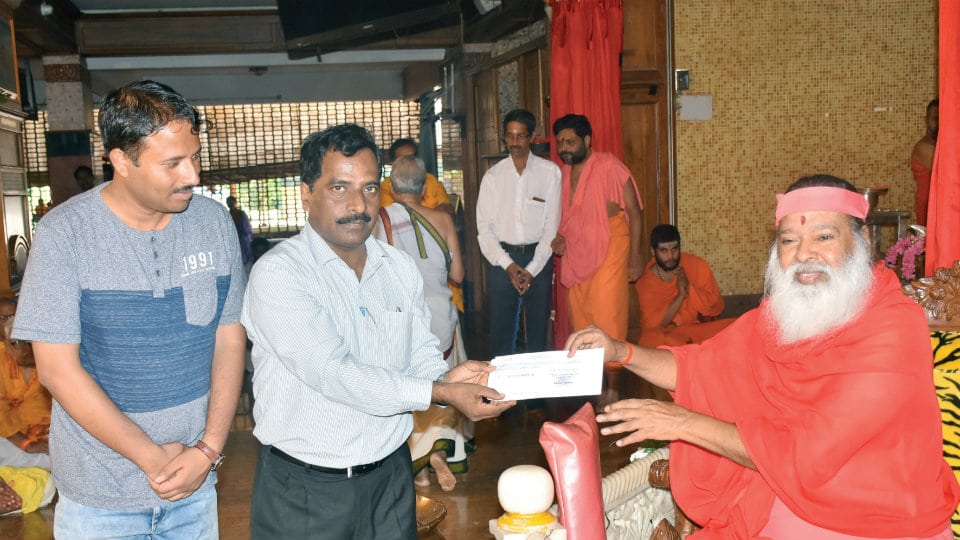 Datta Peetham donates Rs. 15 lakh for Yoga Day breakfast
