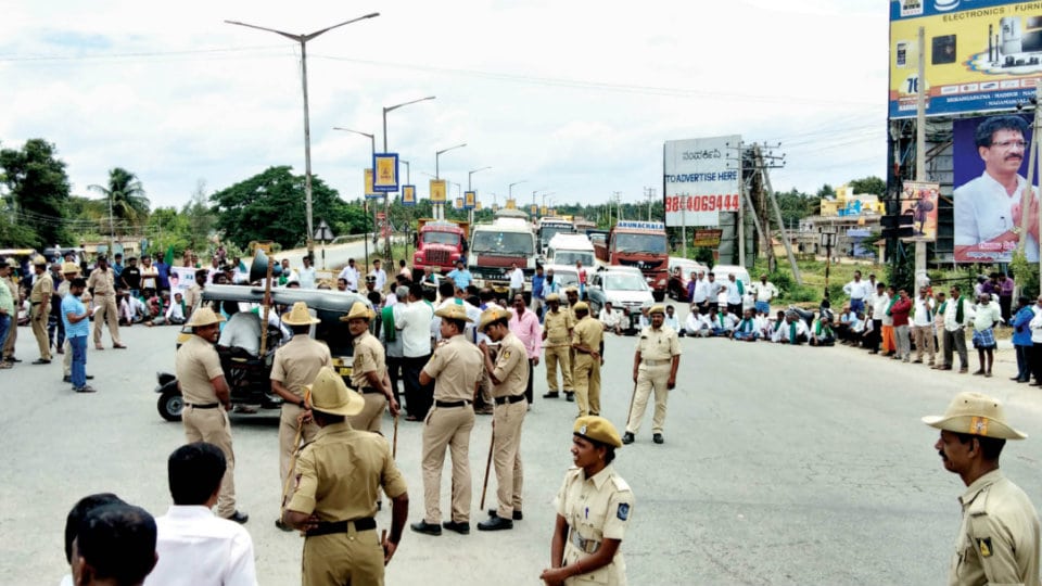 Traffic on Mysuru-Bengaluru Highway disrupted as farmers block Road at Srirangapatna