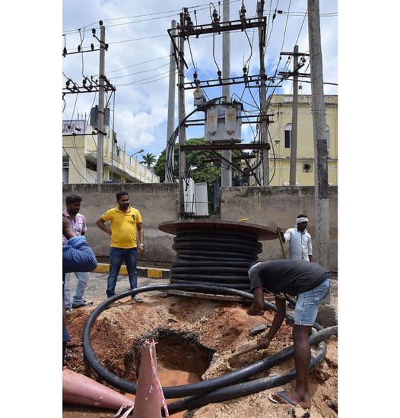 Men at Work Overhead Power Cables Go Underground Star of Mysore