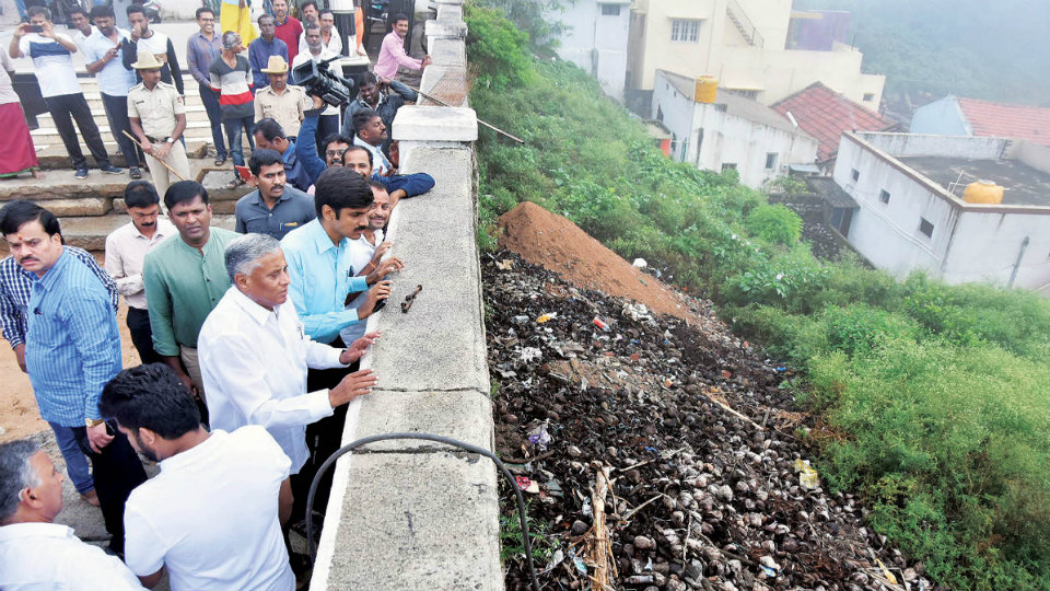 District Minister inspects ongoing works atop Chamundi Hill