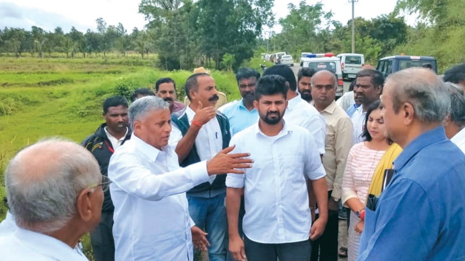 District Minister visits flood-hit areas in Periyapatna
