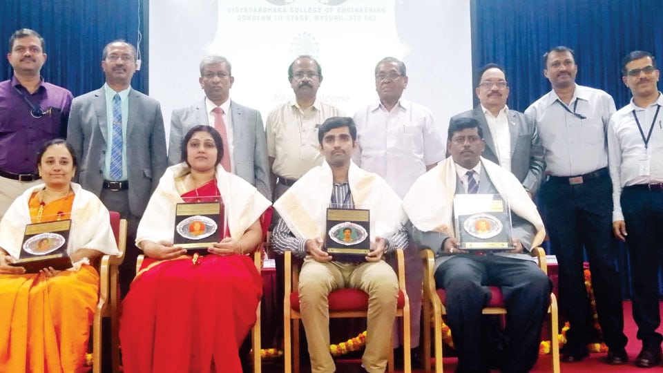 College fetes Ph.D awardees