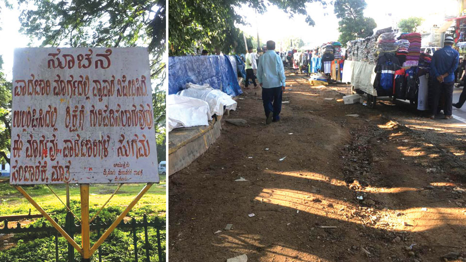 Footpath encroachment force pedestrians to walk on road near Town Hall