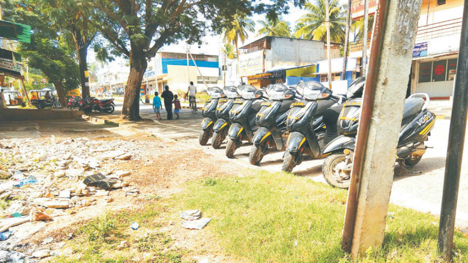 Rental vehicles occupy public parking space on Shivaji Road