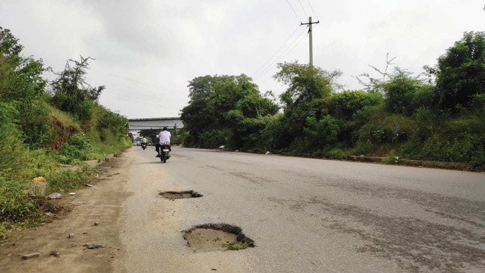 Potholes causing accidents on Manandavadi Road