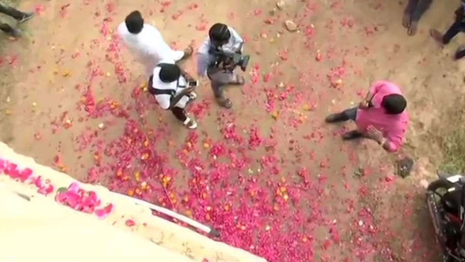 Rose petals showered on Police, sweets distributed